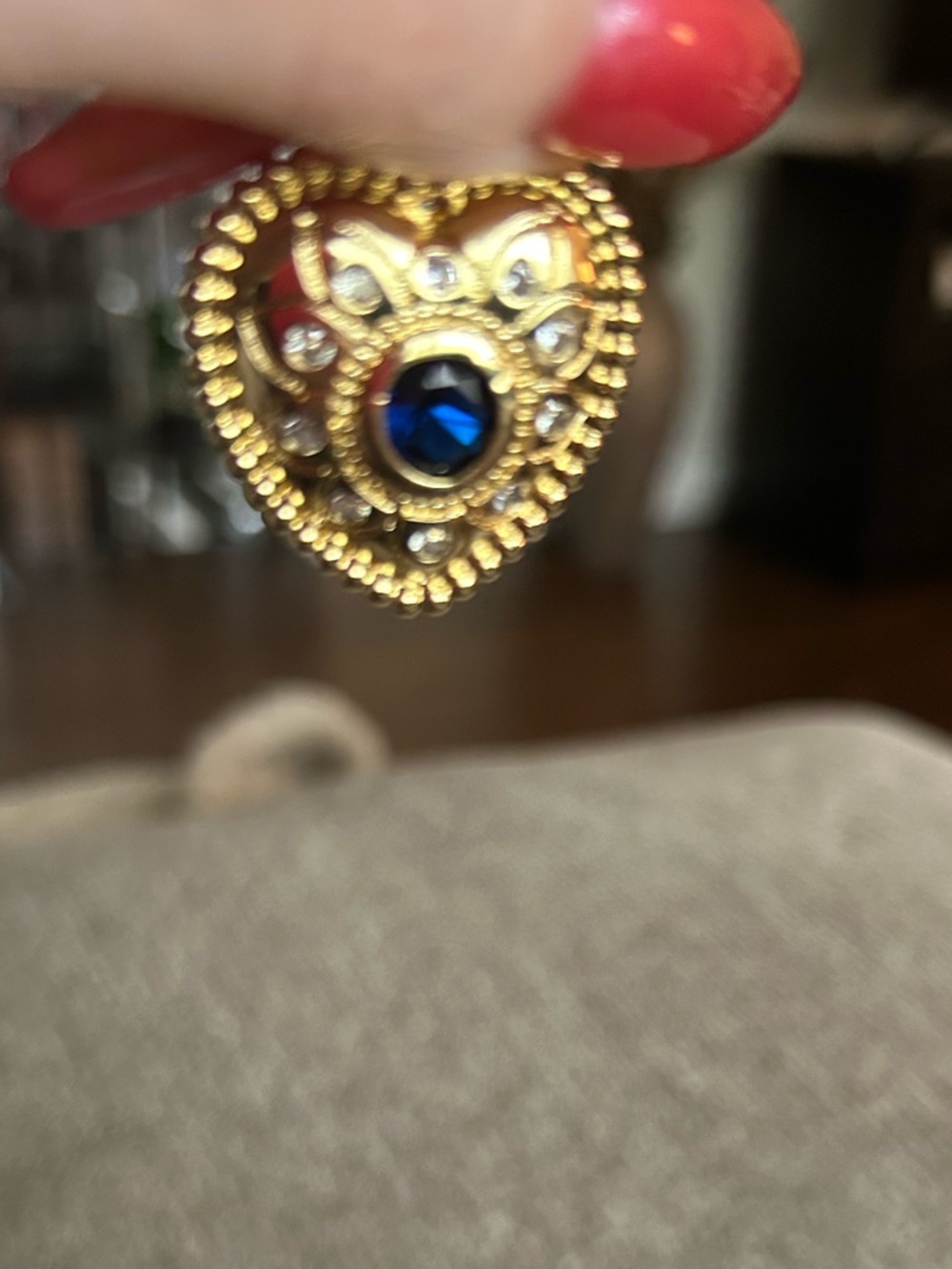 Gold Tone Heart Accent Pendant with Blue Gem